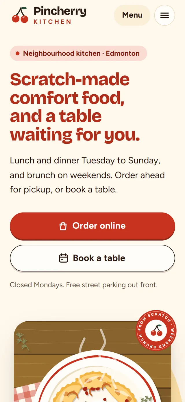 The sample site for Pincherry Kitchen, a fictional restaurant, on a phone. It shows a plate of perogies, an Order online button and a Book a table button.